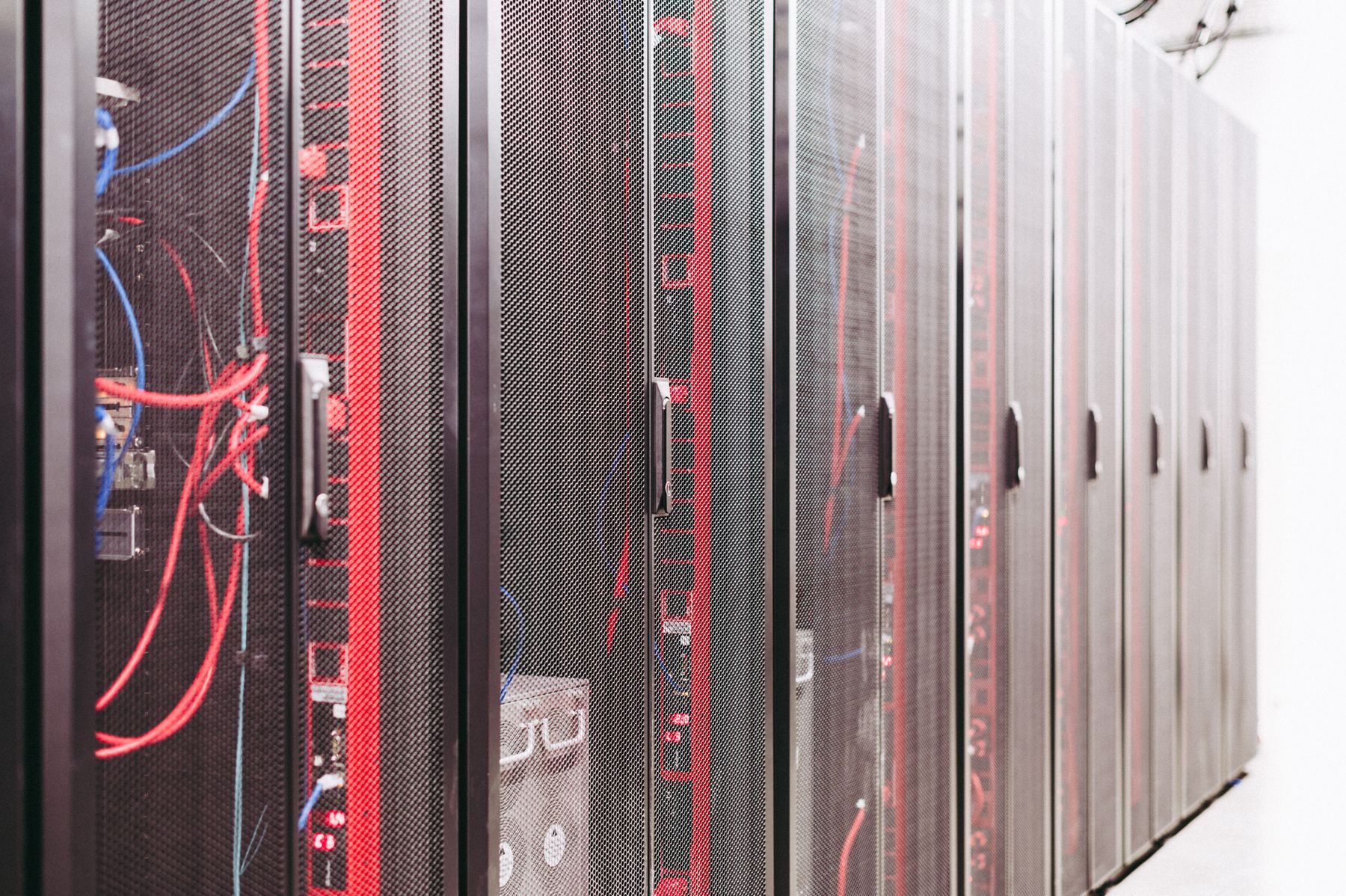 Rows of network and compute racks inside an operating data center