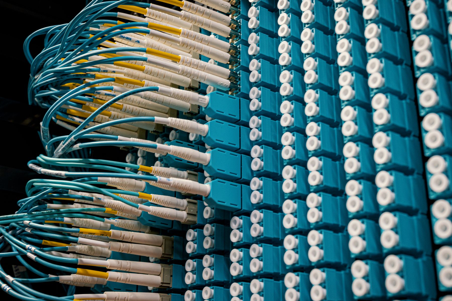 High-density fiber-optic connections in a data center patching system